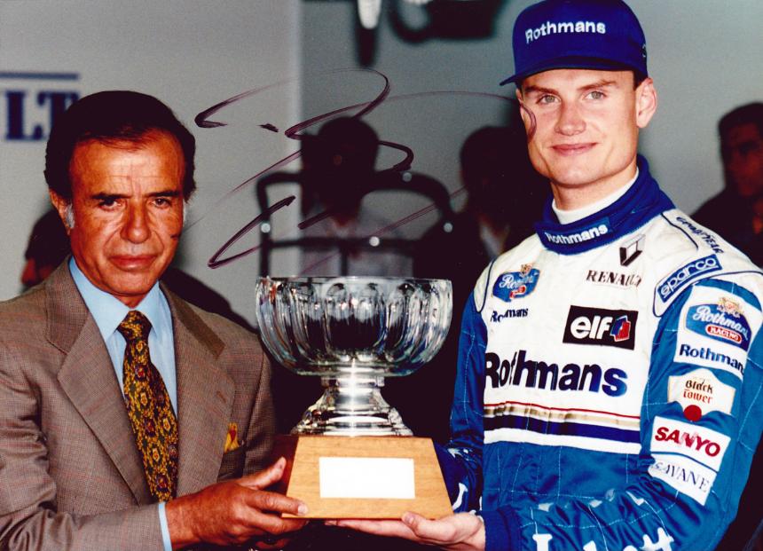 David Coulthard signed photo of him receiving pole Position Trophy at Argentinian Grand Prix.
