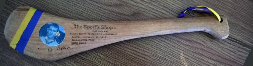 Promotional hurling stick in county colours signed by Wexford goalkeeper Pat Nolan